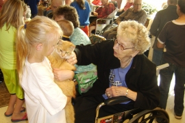 A resident petting a cat